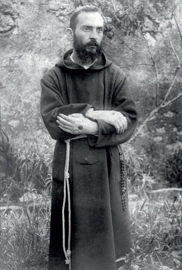 A young Padre Pio showing the stigmata (photo from August 19, 1919)